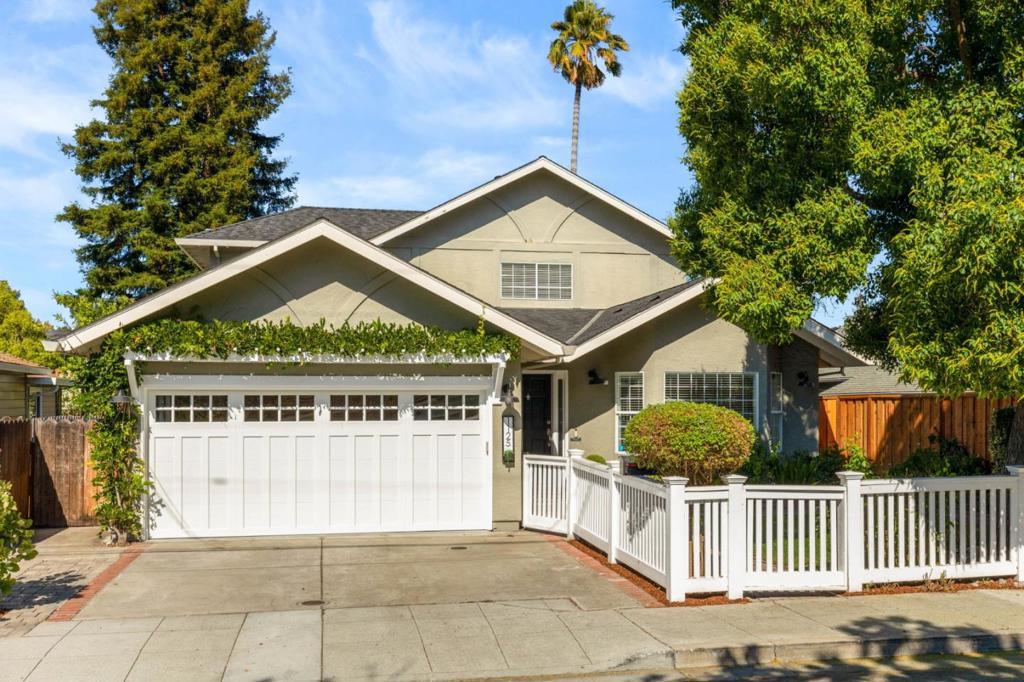 Welcome to 1125 Virginia Avenue, nestled in the highly sought-after Woodside Plaza area of Redwood City. This elegant and modern two-story home offers a generous 2,620 sq ft of living space, designed to accommodate both comfort and style. Upon entering, you'll be greeted by a lovely living room with high ceilings and skylights that bathe the space in natural light, complemented by a cozy fireplace and hardwood floors. The separate dining area, enhanced with wainscot wood detailing, sets the stage for friendly gatherings. The chef's kitchen is a culinary delight, featuring a center island with seating, a gas stove, two ovens, and an eat in kitchen. This area seamlessly extends to a deck and a large private landscaped backyard. Upstairs, the primary suite is a sanctuary, complete with a private patio, two walk-in closets, and high ceilings. An additional upstairs ensuite bedroom offers flexibility and privacy for family or guests. Three more bedrooms and a full bathroom are located on the main level. Modern amenities such as air conditioning, solar, a separate laundry/mud room, and private outdoor spaces ensure comfort and convenience throughout. Situated near Red Morton Park and local amenities, this home is an idyllic retreat for those who appreciate quality and location.
