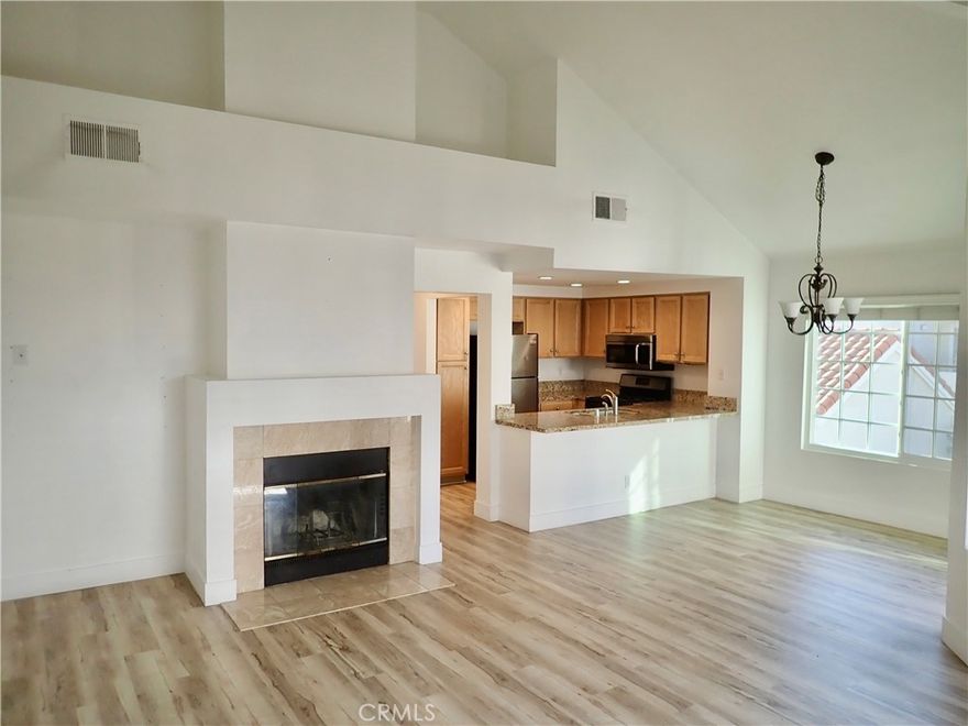 Upgraded throughout Steeplechase Condominium's "Avon" plan 1 bedroom plus 1.25 bath corner end unit with nobody living above or below. Single car private attached garage directly below the living area. Parking Permit for 2nd vehicle overnight parking within this private gated community also included. Spacious living room with high vaulted ceilings and wood burning fireplace. Kitchen with slab granite countertops, hardwood cabinets, and recessed lighting. Built-in appliances include stainless gas oven/range, dishwasher, microwave, and refrigerator. In unit laundry with full size washer and dryer included. Unit faces west, abundant windows and high ceilings providing good natural light. Full bath tub/shower along with additional second sink quarter bath in adjacent dressing area with double wardrobe closets. Private outdoor covered patio is perfect for table and bbq. Owner pays water and refuge. Amenities include 2 pool areas, gym, sauna, clubhouse, and security patrol. Must have Fico score above 700 on credit report and no pets please. Security Deposit $2,700. Only 1 block from shopping, dining, and Erewhon Organic Market at Lost Hills and Agoura Road. Just down the street from great outdoor recreation at Malibu Creek State Park and only 8 miles through the scenic canyon to the beaches of Malibu.