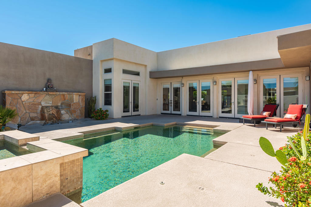 ***UNFURNISHED ANNUAL LEASE ONLY***Stunning contemporary residence in desirable Enclave at Sunrise community. Built in 2006 with the intention of maximizing outdoor desert living and desert entertaining, most every room offers access to the outdoor spaces with amazing mountain views. The beautifully landscaped yard has a covered patio, outdoor fireplace, new Cool Deck surface around a sparkling pool and raised spa. The open concept floorplan features 4 bedrooms and 4.5 bathrooms, strikingly tall ceilings, large kitchen with granite counters, large island and stainless-steel appliances, two separate dining areas and an impressive great room double- lined with 8 French doors, prominent fireplace and a full view to the pool. An inviting master suite has an additional retreat area, large walk-in closets and private full bathroom and in addition there are two en-suite quest bedrooms and an additional 4th bedroom. Amenities also include an oversized two car garage and a solar system. Call for a showing of this stunning home.