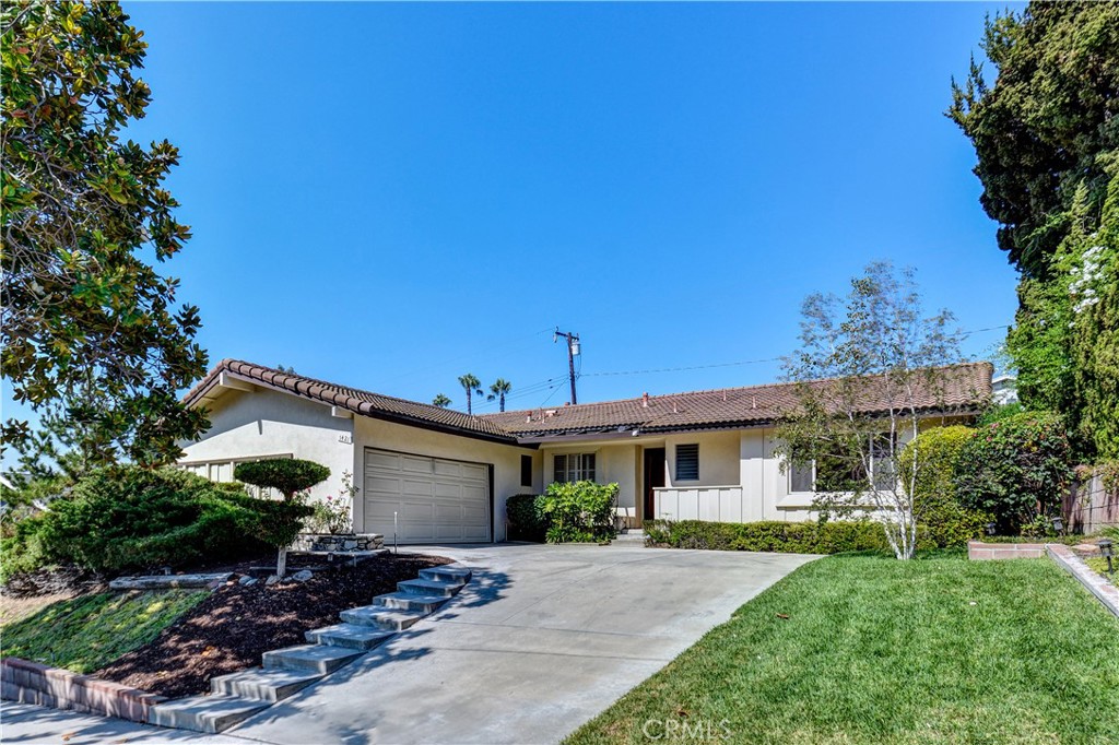 Mid-Century Modern Gem in North La Habra
Located north of Whittier Blvd, this classic 3-bedroom, 2-bathroom home with 1,566 sq ft of living space captures the timeless appeal of mid-century design and offers a true sanctuary feeling. The master suite is privately situated on one side of the home and features an en-suite bathroom with a new vanity.
The spacious living room showcases dramatic vaulted ceilings and a striking dual-sided stone fireplace—visible from both the living room and the adjacent family room. A built-in mid-century wall unit adds authentic charm and serves as the focal point of the space.
The kitchen opens to the family room for effortless flow, while two generously sized bedrooms on the opposite wing provide comfort and versatility. Additional features include an inside laundry room with direct access to the backyard, a covered patio dining area, and a sparkling pool perfect for warm Southern California days.
Upgrades and amenities include a tile roof, newly refinished original hardwood floors, fresh interior paint, and the updated master bathroom vanity.
This is a rare opportunity to own a true mid-century modern home in a highly desirable La Habra neighborhood—a place where every day feels like a retreat.