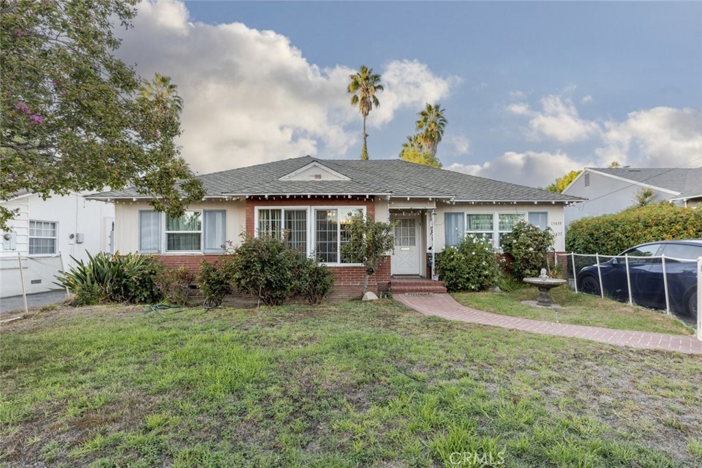 Two houses on one lot, a rare and valuable opportunity! Welcome to this spacious and character-filled 2 bedroom, 2 bathroom home offering 1526 Sqft. of comfortable living space in one of Van Nuys most desirable neighborhoods. This inviting residence combines timeless charm with modern convenience, making it ideal for both owner occupants and investors seeking income potential. Upon entering, you are greeted by a warm and welcoming living room centered around a cozy fireplace, perfect for relaxing evenings. The home features hardwood and laminate flooring, ceiling fans, and large windows that fill each room with natural light. The well-appointed kitchen offers ample cabinet and counter space, making meal preparation both easy and enjoyable. A dedicated laundry room provides everyday convenience, while the thoughtful floor plan allows for flexibility and functionality throughout. Outside, enjoy a beautifully landscaped backyard that offers the perfect setting for outdoor entertaining, gardening, or simply relaxing under the California sun. The spacious lot provides room to unwind while maintaining privacy and comfort. Adding incredible value to this property is a fully equipped 3 bedroom, 2.5 bathroom, 1,200 Sqft. ADU, ideal for extended family, guests, or additional rental income. The ADU features its own private entrance, modern finishes, and generous living space, creating a perfect blend of comfort and independence. Located in a central area near major freeways, shopping, dining, and local schools, this property combines classic appeal, versatility, and investment potential all in one. Whether you are looking for a multi generational living setup or an opportunity to generate rental income, this Van Nuys gem is truly a rare find.
