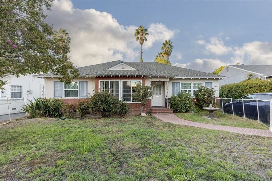 Two houses on one lot, a rare and valuable opportunity! Welcome to this spacious and character-filled 2 bedroom, 2 bathroom home offering 1526 Sqft. of comfortable living space in one of Van Nuys most desirable neighborhoods. This inviting residence combines timeless charm with modern convenience, making it ideal for both owner occupants and investors seeking income potential. Upon entering, you are greeted by a warm and welcoming living room centered around a cozy fireplace, perfect for relaxing evenings. The home features hardwood and laminate flooring, ceiling fans, and large windows that fill each room with natural light. The well-appointed kitchen offers ample cabinet and counter space, making meal preparation both easy and enjoyable. A dedicated laundry room provides everyday convenience, while the thoughtful floor plan allows for flexibility and functionality throughout. Outside, enjoy a beautifully landscaped backyard that offers the perfect setting for outdoor entertaining, gardening, or simply relaxing under the California sun. The spacious lot provides room to unwind while maintaining privacy and comfort. Adding incredible value to this property is a fully equipped 3 bedroom, 2.5 bathroom, 1,200 Sqft. ADU, ideal for extended family, guests, or additional rental income. The ADU features its own private entrance, modern finishes, and generous living space, creating a perfect blend of comfort and independence. Located in a central area near major freeways, shopping, dining, and local schools, this property combines classic appeal, versatility, and investment potential all in one. Whether you are looking for a multi generational living setup or an opportunity to generate rental income, this Van Nuys gem is truly a rare find.