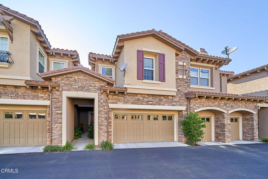 Beautiful 3BR/2.5BA Townhome in Gated Vistas at Indian Oaks.Luxurious 3-bedroom, 2.5-bath townhome with 1,930 sq ft of living space in the prestigious, gated Vistas at Indian Oaks community. This beautifully maintained home features high-end finishes throughout, including a gourmet kitchen with granite countertops, stainless steel appliances, built-in microwave, and gourmet cooktop. Open-concept living and dining areas with cozy fireplace and sliding doors to a private patio--perfect for entertaining or relaxing.Spacious primary suite includes a large walk-in closet and spa-like bath with dual sinks, soaking tub, and separate shower. Two additional bedrooms, a full bath, and upstairs laundry room complete the second level. Other features include central A/C, attached 2-car garage with direct access, and plenty of guest parking.Community amenities include a sparkling pool & spa, dog walk area, scenic hiking trails, and secure gated access. Conveniently located near the 118 freeway and minutes from The Vineyards at Porter Ranch with shopping, dining, and entertainment.