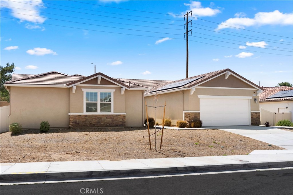 Welcome to the refined piece of art single-story home that does not come on the market very often. This home is located in the new community (Deer Creek), on the cul-de-sac with very few homes on the same street. This astonishing property was built in 2021. One of the few homes recently built with NO HOA, NO MELLO ROOS.  This masterpiece is in Quartz Hill (Lancaster), a very sought after neighborhood in close proximity to shopping centers & freeways. It's the ultimate true definition of today's modern & open concept spread on 2,980 square feet of pure living space. It boasts 4 bedrooms, 3.5 baths, 3 cars tandem garage. Upon entry, you will be met with a beautiful living room leading you to a gourmet oversized eat-in island in the kitchen with luxurious Quartz Counter-tops, walk-in pantry, breakfast nook along with a large family room. The primary room is extremely spacious and has a breathtaking bath with garden tub, deck & a spectacular walking closet. Moreover, the backyard is incredibly beautiful with a mixture of artificial turf & concrete. The beauty of this property extends way beyond words. Come see it!  Last, not least the solar panels will be at no cost to the buyer.
