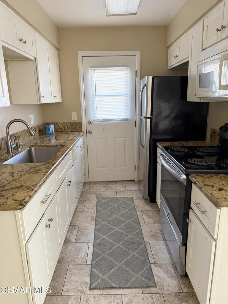 Updated 2 bedroom condo with wood-like floors & central a/c. The kitchen has granite counters, dishwasher and includes a refrigerator. The bathroom has been updated with newer vanity, mirror, and lighting. Single car shared garage & assigned parking space. Community pool and shared laundry facility. Water and trash are included. Centrally located near shopping & parks.