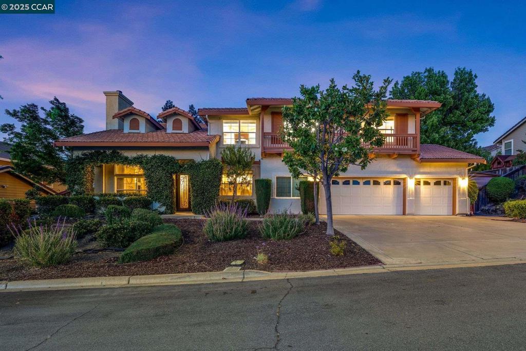 Discover your personal oasis at 1105 Peacock Creek Drive, where luxury meets comfort in this stunning 4294 square foot masterpiece. This aspirational home boasts 5 bedrooms and 3.5 bathrooms, offering the perfect blend of space and sophistication for the most discerning buyer. As you step inside, you're greeted by an airy, light-filled interior that speaks to modern elegance. The heart of the home is a chef's dream kitchen, featuring high-end stainless steel appliances, custom cabinetry, expansive granite countertops, skylight plus large center island. The lavish primary suite is a true retreat with its spa-like bathroom, complete with a soaking tub, walk-in shower, and dual vanities. Throughout the home, you'll find thoughtful details like hardwood floors, recessed lighting, and stylish window treatments. The family room boasts a sleek entertainment center, perfect for movie nights or hosting gatherings. For those who work from home, a dedicated office space ensures productivity in a serene setting. This two-story haven also includes an exercise room for your wellness routine. Located in desirable Clayton, this property offers not just a house, but a lifestyle. Embrace the pinnacle of California living in this exquisite home, within walking distance of the Oakhurst golf course!