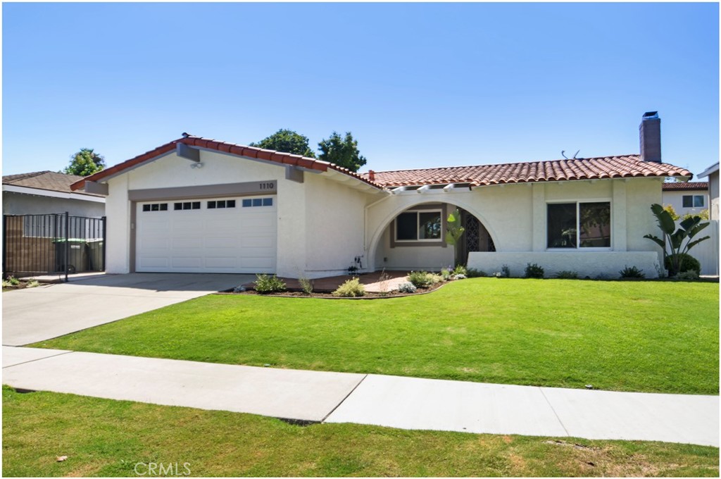 Welcome to 1110 Redding Avenue, a beautifully maintained single-story 4-bedroom, 2-bath home nestled in the highly sought-after Mesa Woods neighborhood of Costa Mesa. Flooded with natural light, this spacious residence features an open floor plan with vaulted ceilings, modern LVP flooring, and both formal living and family rooms anchored by a cozy fireplace. The renovated kitchen flows effortlessly into the main living areas, making it perfect for both everyday living and entertaining. Recent upgrades include a brand-new air conditioning and heating system along with newer ductwork, ensuring year-round comfort. The primary suite offers a walk-in closet and en-suite bath, while the serene backyard is surrounded by lush landscaping—ideal for relaxing or hosting gatherings. With a 2-car attached garage, central A/C, and a prime location near South Coast Plaza, local parks, and top-rated schools, this move-in-ready home offers the perfect blend of style, functionality, and convenience.