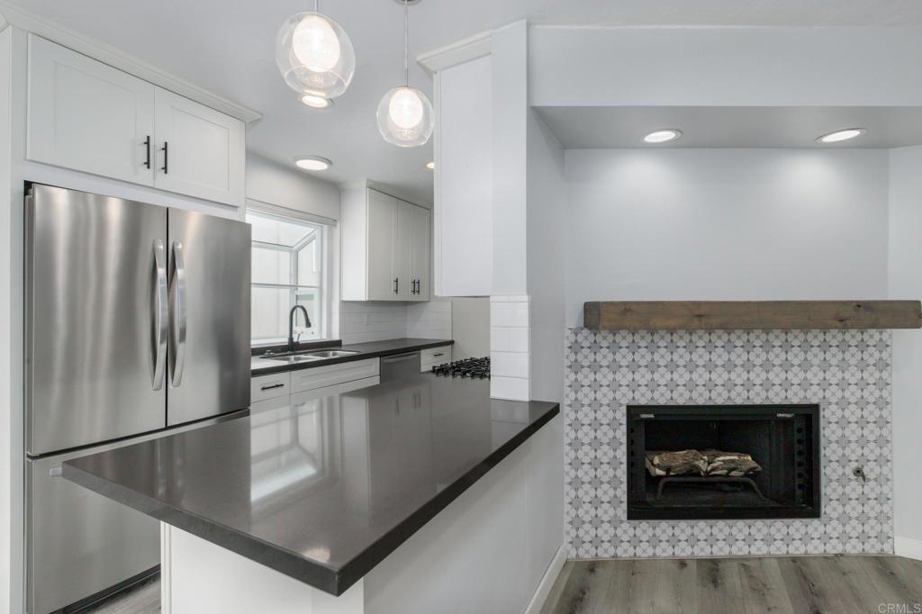 Welcome to this beautifully upgraded upper-level condo featuring 2 bedrooms, 2 bathrooms, and 1,018 square feet of stylish, modern living in the heart of San Diego. Please note, stairs are required to access this upper-unit home. Renovated in 2019 with contemporary finishes and a neutral color palette, this home features a spacious open-concept living area with abundant natural light, ample hallway storage, generously sized bedrooms, and a private patio perfect for lounge seating or a Peloton bike. The primary suite includes an oversized closet and en-suite bathroom, while recent upgrades include double-panel energy-efficient windows and patio slider (2022), all-new appliances, an in-unit washer and dryer (2024), and a new roof (2025). Perfectly located near Sunset Cliffs, Ocean Beach, Mission Bay, Liberty Station, and Downtown, with easy access to grocery stores, restaurants, public transit, and major freeways. Community amenities include covered parking, two swimming pools, a spa, and beautifully maintained landscaping. Rent includes water and trash services. This move-in-ready condo offers the perfect blend of comfort, style, and convenience.