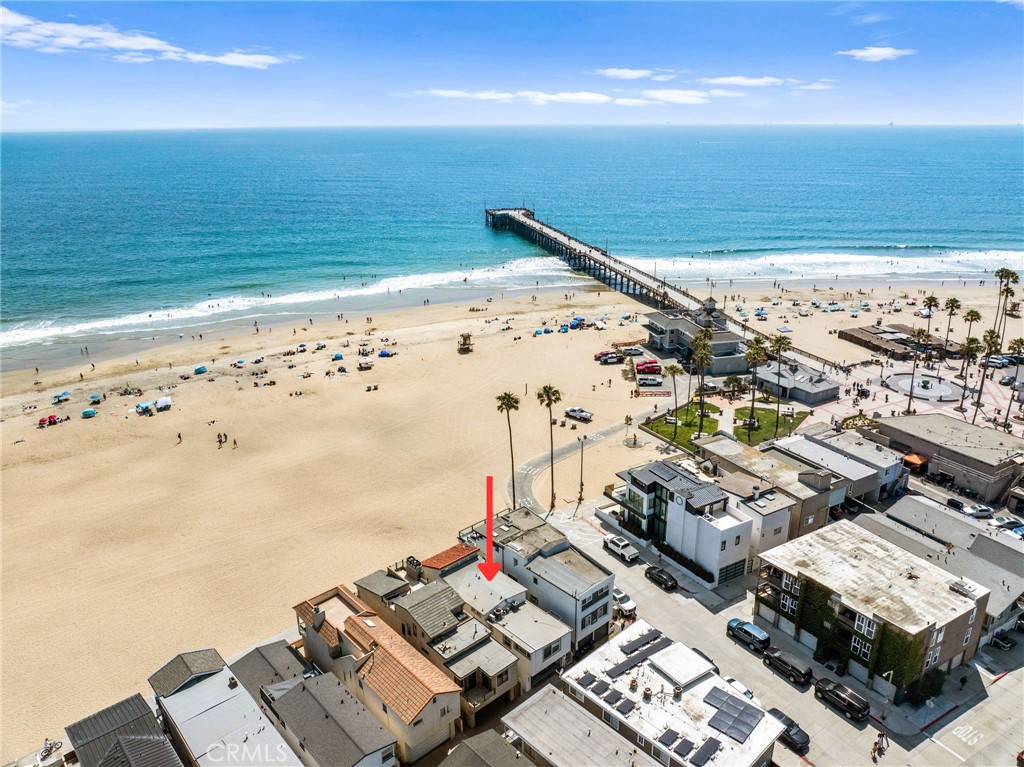 Welcome to your dream oceanfront beach house — ideally located just steps from the Newport Pier, with sweeping ocean views and a front-row seat to coastal living. This recently updated home combines timeless charm with modern upgrades. Inside, you’ll find brand new flooring, fresh interior and exterior paint, and high-end automatic shades throughout. The kitchen features a new refrigerator, range, and microwave. A fully rebuilt upstairs balcony offers ocean breezes and sunset views, and the remodeled primary bathroom features a sleek new shower and refined finishes. Brand-new dual-pane windows and sliding glass doors flood the home with light, while a new ADT security system and updated exterior gates provide added peace of mind. As an added bonus, the property includes a separate mother-in-law suite with its own private entrance, kitchen, and living area — perfect for guests, extended family, or rental income. This home can be sold fully furnished, including all brand-new furniture, linens, and curated decor — making it completely move-in ready from day one. This is oceanfront living done right — walk to a plethora restaurants, bike the boardwalk, and fall asleep to the sound of the waves.