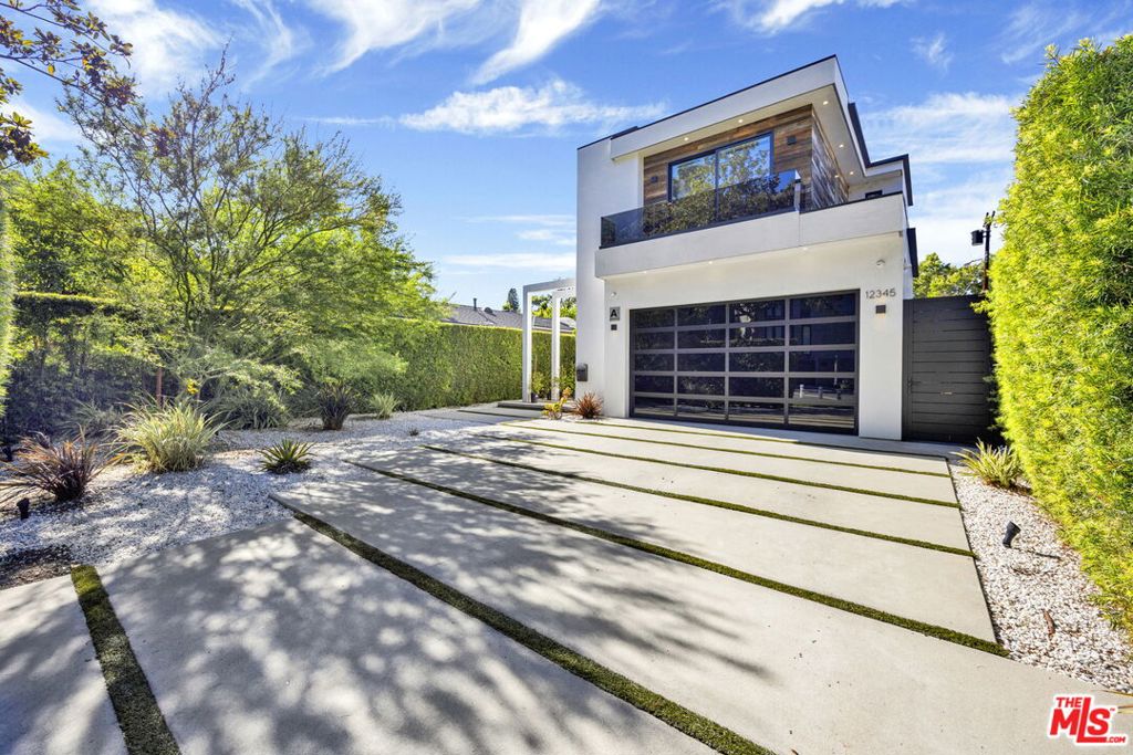 Stunning newer construction built in 2020 by the highly regarded Arzuman Brothers, located in the heart of Studio City's coveted Silver Triangle and within the sought-after Carpenter School District.This California contemporary home offers a seamless indoor-outdoor flow with clean lines, warm finishes, and an open-concept layout that's perfect for both everyday living and entertaining. The chef's kitchen is a dream with a large center island, custom cabinetry, high-end appliances, and a built-in breakfast table.Out back, the private yard is surrounded by tall ficus trees and features a pool, spa, built-in BBQ, fire pit, and plenty of space to relax or host guests. All bedrooms are en-suite and located upstairs, including a spacious primary suite with a walk-in closet, spa-like bath, and private balcony overlooking the backyard.Just a short stroll to the shops and restaurants on Ventura Blvd and close to some of the best public and private schools in LA. Other highlights include smart home features, custom built wine cellar, fully owned solar panels, and two Tesla backup chargers.
