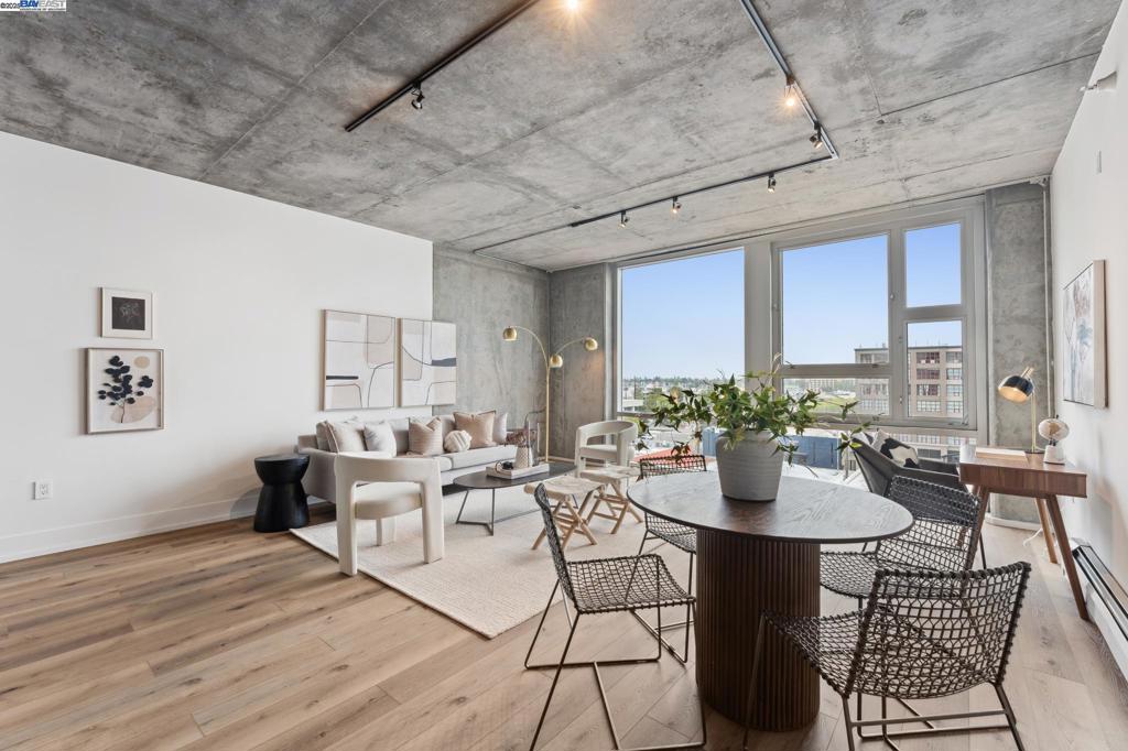 Perfectly urbane and stylish chic, this open and inviting loft-like property is sunny and bright with large volume and amazingly functional. Head straight for the kitchen where a large island will inspire entertainment. Glimpse at the sailboats in the distance through floor to ceiling windows, and soak in the sun while enjoying the spacious cooking, living, and dining area. Rare very large bedroom flat has a generous walk-in closet and plenty of wall space for dressers or desk. The finishes are lovely with brand new carpet and beautiful new wood grain floors contrasting the cool concrete ceilings and posts. The Sierra community will enrich your lifestyle with 24/7, spacious fitness center, lap pool, sauna, media room with conference space and billiards, and even a convenient deli on site. It’s a perfect place to live in the ultimate Oakland location. Enjoy the restaurants, breweries, retail and entertainment right outside your door. Travel so easily with BART, SF Ferry, and Amtrak a very short walk away and easy highway access.
