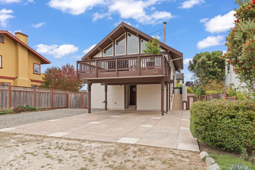 Welcome to your own private hideaway in the heart of Miramar. Enjoy sunny mornings on your deck with a cup of your favorite beverage, overlooking a 180-degree country view and listening to the sounds of nature. From the living room, watch amazing sunsets as sailboats and fishing boats come home to port. After sundown, the scene converts to twinkling harbor lights. High vaulted ceilings bring natural light and airiness to the primary 2nd floor living space, while the reverse floor plan creates a cool 1st floor area for sleeping. From the master bedroom, you can hear sounds of the ocean late at night. The home is well maintained with beautiful touches throughout. Custom primary bathroom with radiant floor heater, Brazilian walnut and porcelain slate flooring, and two walk-in closets off the larger bedrooms create a cozy and attractive living space. Custom glass was installed to deter migratory birds from injuring themselves, and many of the appliances are new. Four parking spaces allow for a boat or RV. A neighborhood path leads to Quarry Park, Spangler's Market and all the activities at Pillar Point Harbor. Miramar beach, the coastal trail, and Surfers Beach are minutes away. The Harbor has entertainment and dining and shopping its about 3 miles to downtown Half Moon Bay.