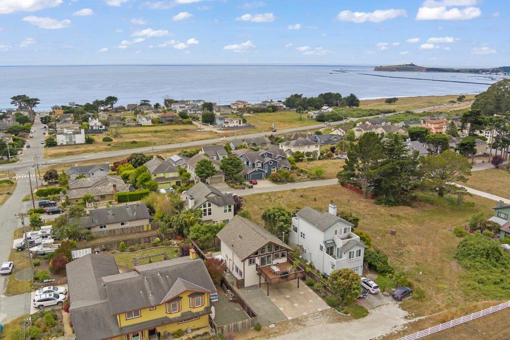Miramar with Ocean and ranch views. Quiet location on the East side of Highway 1. Perched on the hill providing views of the ocean and harbor from the living room. From the kitchen and deck off of the family room you overlook a pond, green fields and cows roaming the ranch. This home is for your most finicking buyers. Attention to detail throughout the interior and exterior of the home. Reverse plan provides the opportunity to enjoy the views from the second story living space. Tons of natural light coming in from the front and rear of the house. Custom treatment applied to the large window that deter birds from hitting the glass and injuring themselves. Hardwood floors, walk in closet, custom primary bathroom. Vaulted ceilings really add openess to the space. Access to Quarry Park thru a neighborhood path, which also gets you to the elementary school, Spangler's Market and all the activites at Pillar Point Harbor. The coastal trail, Mavericks, trails to Moss Beach Fitzgerald Marine Reserve. Dining and entertainment options in the Harbor. It's about 3 miles to downtown Half Moon Bay for more dining options, Safeway, CVS, New Leaf Market, Ace Hardware and much more. Commuting to the Peninsula, Silicon Valley or San Francisco, all within 30-45 minutes from here.