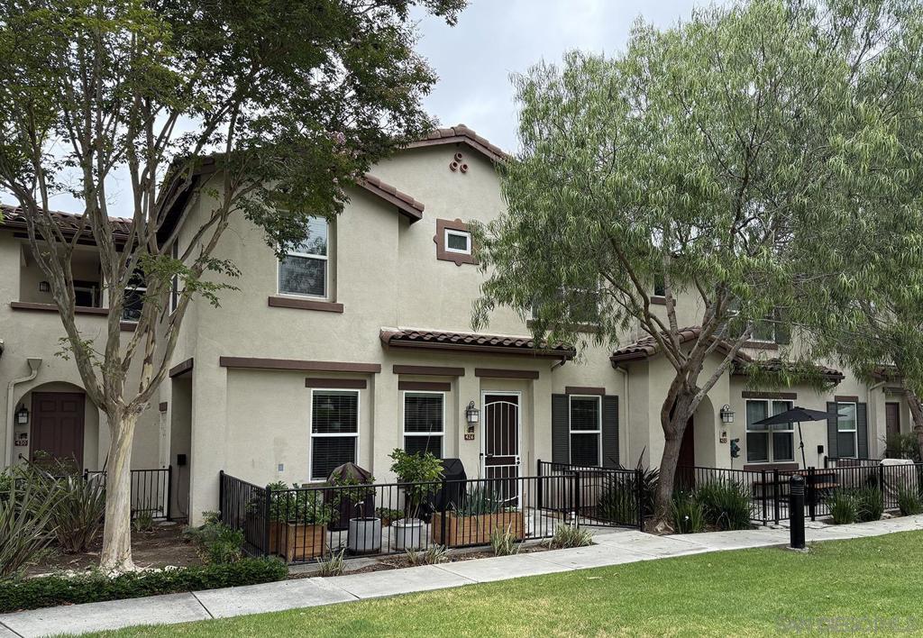 Updated, Modern, Move-In Ready, 3 bed/2.5 bath townhome offering the largest and most desirable floorplan (1,378 sq. ft.) in the most desirable location in the community. 5-minute walk to the NCTD Sprinter, connecting you to Amtrak, Coaster, Metrolink, CSU San Marcos, Downtown San Diego, Orange County, and LA—perfect for daily commuters or investors. Enjoy a private, secure, inward-facing unit that opens to a community playground—ideal for families. Spacious primary suite features two walk-in closets and a dual vanity, while a separate laundry nook keeps living spaces clutter-free. Upgrades include: Modern luxury vinyl wide-plank flooring through out, new Toto Drake toilets, matching ceiling fans, and upgraded A/C. Fully integrated smart home w/ dimmable LED lighting in every room. Walk to Vista Village (Cinepolis, The Wave, Frazier Farms) and the vibrant Downtown Vista scene of breweries, eateries, and entertainment. Just 8 miles to the coast! This home offers space, smart living, and unbeatable access—schedule your tour today! Home qualifies for 3% down conventional loan with no PMI - inquire with lender or ask agent.