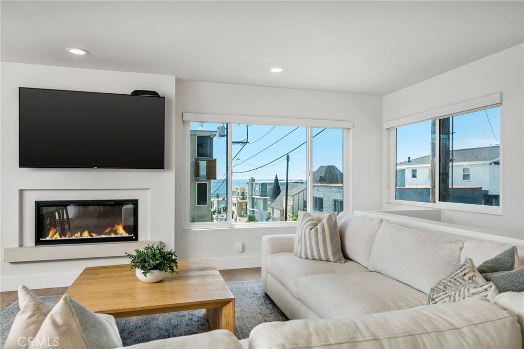 Beautiful fully furnished 3-bedroom, 3-bathroom home in a superb location just four blocks from the ocean. The 1,760 sq ft home has been completely remodeled and features a main living area with partial ocean views and a chef's kitchen equipped with a 6 burner Viking range, griddle and double oven and a Miele coffee maker. The primary suite is a relaxing retreat, complete with a fireplace, a luxurious bathroom with a steam shower and heated floors and a spacious walk-in closet. A separate family room on the lower level provides an additional space for gatherings with the convenience of a bar area outfitted with a dishwasher, ice maker, and wine fridge. Additional features include Sonos surround sound throughout, an electric car charger, central AC and a tankless water heater. Located midway between downtown Manhattan Beach and El Porto, this home offers easy access to shopping, restaurants, highly rated schools and the beach.