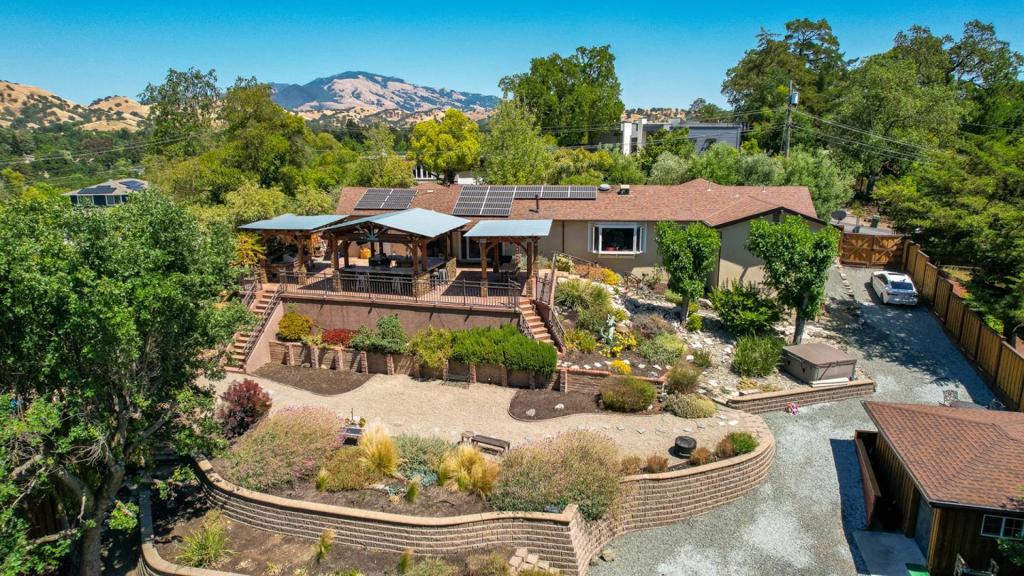 Welcome to your Walnut Heights sanctuary, where luxury, comfort, and California living come together. This custom Craftsman-style retreat invites you to savor breathtaking sunsets, stroll through your own private vineyard, and host unforgettable gatherings. The chefs kitchen, with commercial-grade Thermador appliances and striking fusion granite, flows into a warm great room with hickory floors and custom wood ceilingsperfect for everyday living or entertaining in style. A premium audiophile sound system surrounds both indoor and outdoor spaces with music. Step outside to your personal oasis: a built-in bar and BBQ, peaceful pond with waterfall, hot tub, fire pit, and a beautifully designed wine cellar ready for intimate tastings. Every detail is crafted for convenience and eleganceremodeled bathrooms, epoxy floors in the garage and shed, 22-panel owned solar, custom iron gate, knotty alder front door, and generous storage. With RV/boat parking and side yard access, this home offers both luxury and practicality. All just minutes from downtown Walnut Creeks shops, dining, top schools, medical centers, BART, and highways 24/680.