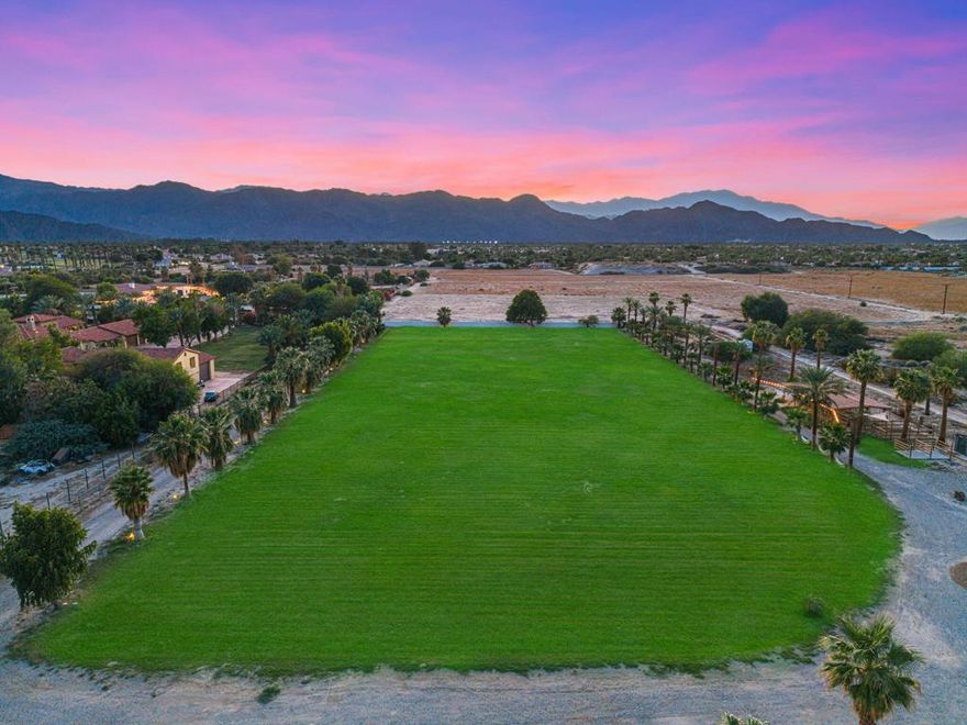 Panoramic desert and mountain views frame this rare five-acre gated estate in the heart of Indio. Behind automatic entry gates, the property unfolds as a private desert retreat with endless lifestyle and investment potential. Two charming bungalows echo the sought-after Joshua Tree vibe while offering comfort and flexibility, the main residence is just under 1,400 square feet with two bedrooms and two baths, and the second bungalow is just under 800 square feet with two bedrooms and one bath.Outdoors, the setting is exceptional. A sparkling pool invites relaxed desert living, horse corrals and wide-open grounds make it ideal for equestrian use, and a three-car garage with soaring ceilings provides room for car lifts or a collector's workshop. The property is fully fenced, has its own well, and power is already pulled to the site, creating seamless options for expansion or future development. With flexible zoning and the potential to subdivide into multiple parcels, the land can evolve with your vision.An extraordinary desert opportunity awaits. Whether your envision a private escape, an equestrian estate, an event destination, or a long-term investment, this property's scale and flexibility open the door to multiple possibilities. Take the next step and explore how 80886 Avenue 50 can work for your goals, schedule your private showing today.