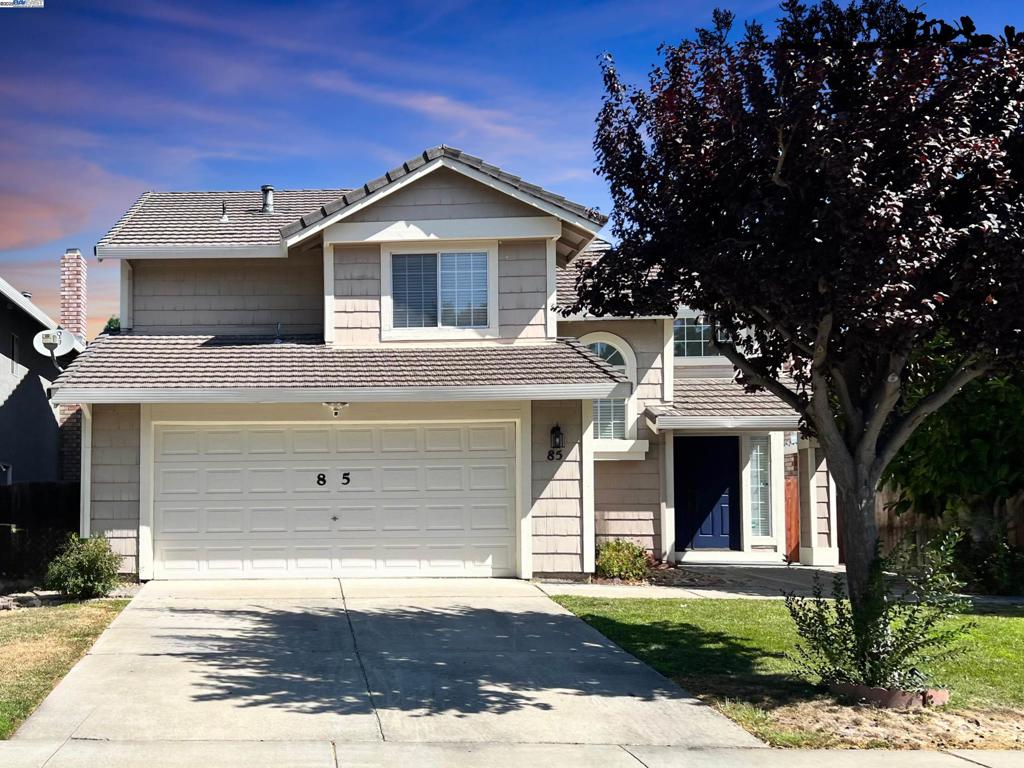 This is a charming 3 bedroom, 2.5 bath home nestled in a quiet cul-de-sac in one of Tracy’s friendliest neighborhoods. Step into the sunlit living room featuring vaulted ceilings, rich hardwood floors, and an open, airy feel. The modern kitchen is a true highlight with granite countertops, ample cabinetry, and a cozy breakfast bar perfect for morning coffee or casual meals. It flows seamlessly into a backyard oasis with a built-in BBQ island, lush lawn, and plenty of space for kids or pets to play. A dedicated dog run along the side adds extra convenience for pet lovers, and a spacious storage shed offers room for tools, gear, or seasonal décor. Upstairs, the spacious primary suite boasts a dramatic sloped ceiling that enhances its architectural appeal and creates a sense of openness. 2 additional bedrooms offer flexibility for guests, a home office, or a personal gym. Whether you're hosting weekend gatherings or enjoying quiet evenings outdoors, this home blends comfort, style, and functionality in a location you'll love.