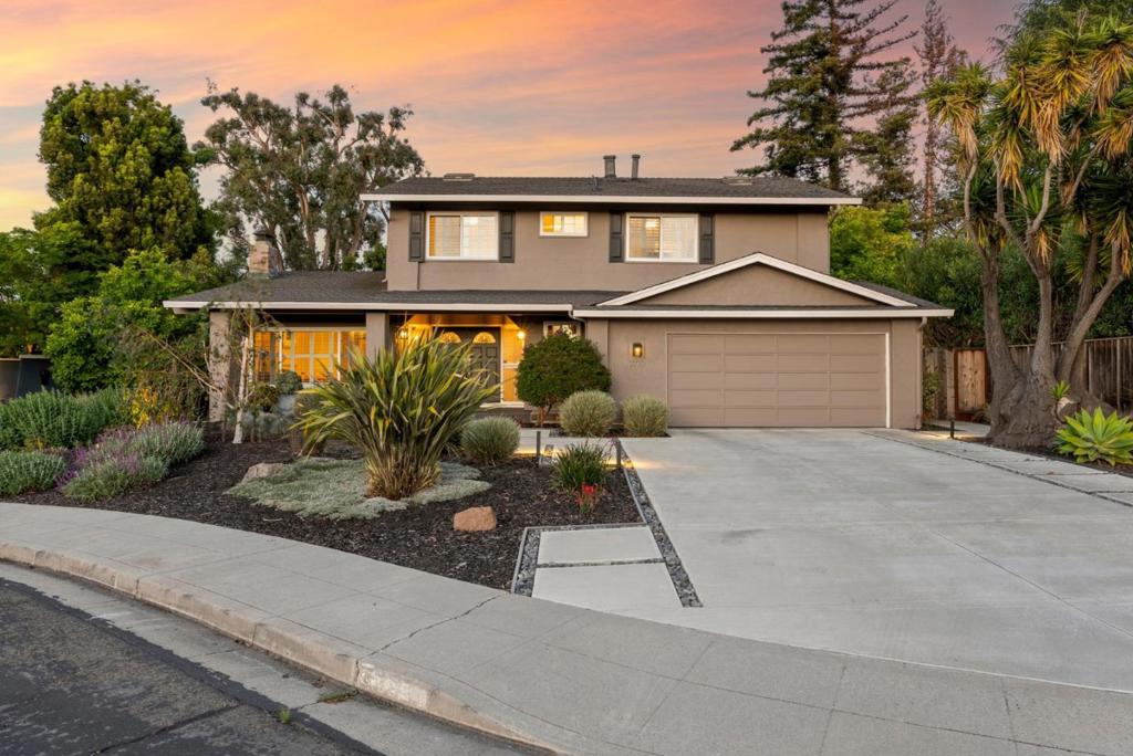 This beautifully maintained home offers a perfect blend of comfort, style, & functionality. The remodeled kitchen seamlessly opens to the family room, creating a warm & connected space ideal for everyday living & entertaining. A bright & open living room features a soaring vaulted ceiling & a cozy fireplace, adding both character & charm. The main level also includes a separate formal dining room perfect for hosting guests. Upstairs you'll find three generously sized bedrooms in addition to the oversized primary suite. The luxurious primary retreat boasts a spa-like bathroom with high-end finishes, offering a serene escape from the everyday. The outdoor spaces are equally impressive with a wooden deck & private spa, a beautifully designed patio area complete with a fire pit & an expansive, fully fenced yard featuring a lush lawn & a raised vegetable garden perfect for those with a green thumb. This home offers the ideal combination of thoughtful upgrades, inviting living spaces, & exceptional outdoor amenities. Top-rated schools; Cupertino High School, Hyde Middle School, & Eisenhower Elementary. This home also benefits from low Santa Clara utilities & close proximity to major highways, parks, shopping centers & leading tech companies. *Some interior photos are virtually staged.