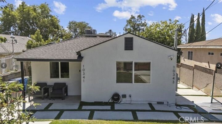 This beautifully updated single-family home offers 2 spacious bedrooms, 2 modern bathrooms, and 1,126 square feet of stylish living space designed for comfort and functionality. From the moment you enter, you'll notice the bright and welcoming atmosphere, enhanced by crisp white walls and recessed lighting throughout the interior. The heart of the home is the thoughtfully designed kitchen, which boasts stainless steel appliances, elegant modern cabinetry, and a sleek panel-ready refrigerator that blends seamlessly into the cabinetry design. It's a perfect space for everyday cooking and effortless entertaining. Both bathrooms are outfitted with beautiful tiled showers that add a touch of luxury to your daily routine. A dedicated laundry room with built-in shelving provides extra storage and convenience, and the washer and dryer are included for your use. Beyond the interior, residents can enjoy a private backyard patio designed for relaxation, outdoor dining, and entertaining. Whether you're hosting friends or simply enjoying the fresh air, this outdoor space offers a peaceful retreat. Located in a quiet and well-established neighborhood in Tujunga, this home delivers a perfect blend of modern amenities, thoughtful design, and everyday comfort.