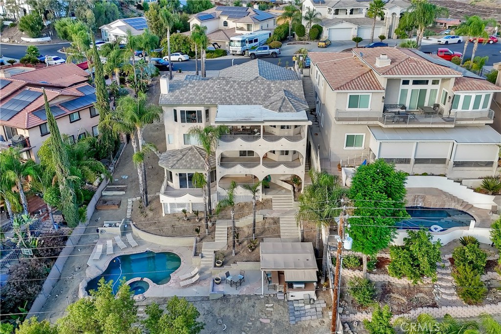 Welcome to your Canyon Lake dream home—where luxury meets panoramic views! This beautifully upgraded residence offers 3 spacious bedrooms, a dedicated office, and 3 bathrooms. From the moment you enter, you're greeted by a light-filled open floor plan, vaulted ceilings, and expansive windows that frame breathtaking views of the surrounding hills and rooftops.
The chef’s kitchen is a showstopper, featuring sleek cabinetry, quartz countertops, a large center island, and top-of-the-line appliances—perfect for entertaining or everyday living. The primary suite is a true retreat with a private balcony, spa-like bath, and serene sunrise views.
Enjoy your own slice of paradise with a saltwater pool and spa, ideal for relaxing or hosting guests year-round. Additional highlights include a 3-car garage, modern finishes throughout, and multiple indoor/outdoor spaces that make the most of the stunning natural setting.
Located in the gated community of Canyon Lake with access to boating, beaches, parks, and more!