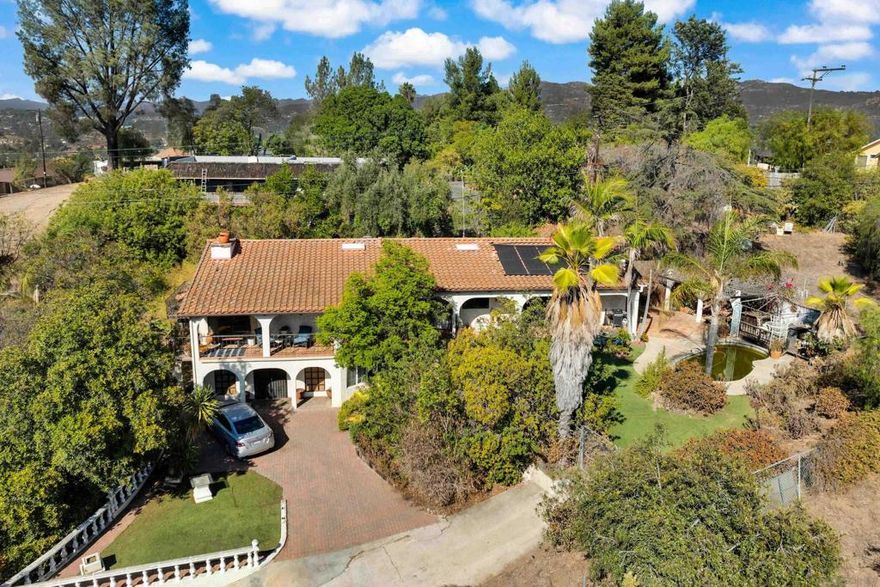 Investor Special - Endless upside potential nestled in the hills of beautiful Granite Hills! Unique Spanish style home on 0.68  acre lot offering good bones, character, privacy, and opportunity. Step inside to find vaulted wood beam ceilings creating a dramatic ambiance.  Fireplaces in both the living room and family room.  Views can be enjoyed from the living room, primary bedroom, and a wraparound deck.  This large lot with access from another street provides excellent ADU potential (perfect for additional income or multigenerational living).  This property is ready for investors!