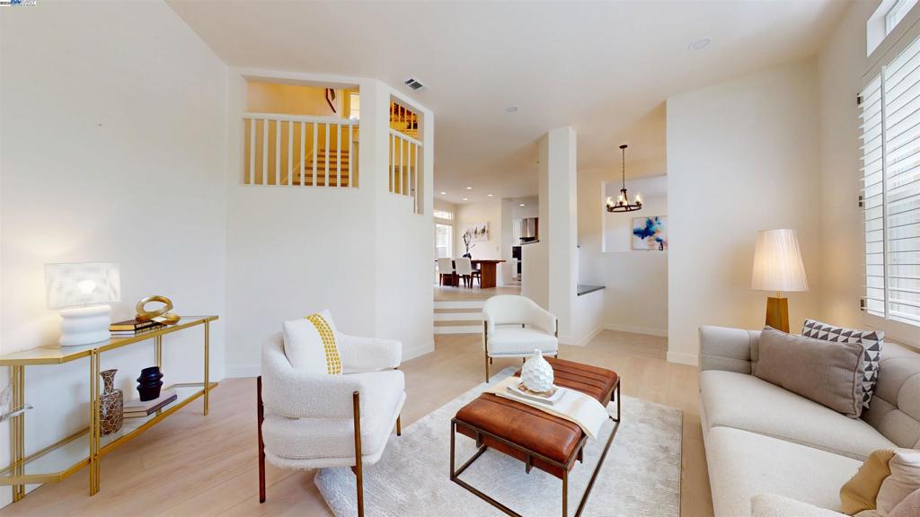 Spacious corner unit — largest floor plan in gated Liberty Commons! 3 beds, 2.5 bath w/ modern updates: new quartz bath counters, vessel sinks, engineered wood floors, fresh paint, new lighting, custom window shutters. Kitchen w/ granite counters & backsplash, stainless appliances, new fridge, breakfast nook & dining area. Formal dining room, family room, living room w/ gas fireplace. Primary suite w/ walk-in closet & custom shelving. Inside laundry w/ washer & dryer. Whole house fan, central A/C & heating. Garage w/ epoxy floors & extra storage. Community: heated pool, hot tub, clubhouse. Prime location — walk to BART, hospitals, shopping, library, Lake Elizabeth Park, dining. Easy freeway access. Move-in ready! Motivated seller.