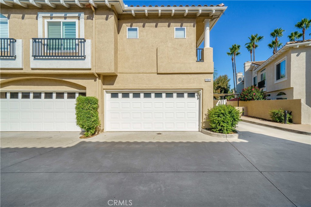 Welcome home to 11544 Treeview Ct., the ONE you have been waiting for! Situated on one of the most unique lots in the Traditions community, this home has it all. Boasting approximately 1407 square feet, 2 bedrooms, and 2.5 baths, this remodeled light-filled home will take your breath away. One of the key features is that you have no immediate neighbor with their front door facing directly across from yours. In its place you have a front yard with a covered seating area and a beautiful mature king palm tree that adds to your entertaining space. As you enter, you are greeted by the spacious family room with wood laminate floors and a cozy fireplace that has been updated with faux brick and a wood mantle. Just off the family room are the dining area and the completely remodeled kitchen. The kitchen includes all new cabinetry, new appliances, and stunning solid-surface stone countertops. There is a powder room and a laundry closet conveniently located downstairs along with ample storage under the stairs. Upstairs are the primary and second bedrooms and bathroom. The primary bedroom has a bathroom with his and hers sinks and a large walk-in closet. The low-maintenance turf backyard provides plenty of space for entertaining and pets and includes a small shed for storage. Included with the home are all the appliances, including the washer and dryer, along with the shades and patio furniture located outside. The Traditions community has it's own small park along with a resort style pool area perfect for those hot summer days. Located within walking distance to parks, shopping, dining, and award winning schools this gem has it all. Hurry, this one is going to go quick!