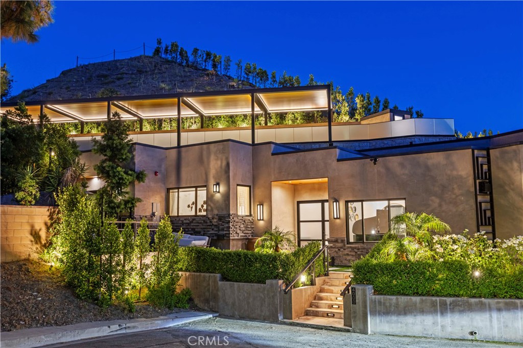 Welcome to this rare and exquisite residence nestled at the end of a quiet cul-de-sac in Glendale’s most prestigious neighborhood — the Chevy Chase Country Club. Built in 2020 and masterfully designed by an award-winning architect, this 3-bedroom, 2.5-bath home offers a seamless blend of modern luxury and timeless elegance.
Step through a custom-crafted entrance into a charming foyer that leads to an expansive grand room with soaring ceilings and abundant natural light. The home boasts stunning San Rafael mountain views and sits on a private hill, offering a rare sense of tranquility and seclusion.
At the heart of the home is a gourmet chef’s kitchen, fully equipped with top-of-the-line Thermador appliances and designed for both function and entertaining. Enjoy outdoor living with a multi-level backyard oasis featuring an outdoor kitchen, lush landscaping, and ultimate privacy — perfect for gatherings or peaceful evenings under the stars.
Retreat to spa-inspired marble bathrooms, including a luxurious Roman tub centerpiece. Spacious walk-in closets, high-end finishes, and thoughtful details throughout make everyday living feel exceptional. A two-car garage includes a Tesla charging station for modern convenience.
This is more than just a home — it’s a lifestyle. Don't miss the opportunity to lease this truly one-of-a-kind property in one of Glendale’s most sought-after enclaves.