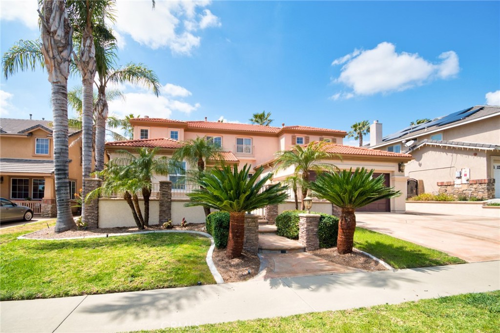 this beautiful home built by quality builder Lennar is located in award-winning Etiwanda/Los Osos school district and the most desirable part of Rancho Cucamonga. Closed to shopping at Victoria Gardens and walking distance to John Golden elementary school and Day creek park. Great floor plan with big kitchen that opens to family room with a fireplace and a downstairs bedroom with built-in desk and bed. Tile and hardwood flooring throughout and 3 bedrooms upstairs with carpets. Accent crown moldings and custom window casings on all of energy efficient dual pane windows and beautiful wainscotings in living room & dining room. All closets have built-in organizers and guys will love the 3 car tandem garage with built-in cabinets. Front yard greets with fully landscaped courtyard and covered patio, playset & built-in BBQ in backyard with wrought iron side gate for RV parking. Also located in quiet cul de sac. SOLAR ENERGY PANELS that will save you minimum of $300 a month in electricity bill. This home will not last long so come see and fall in love with it.