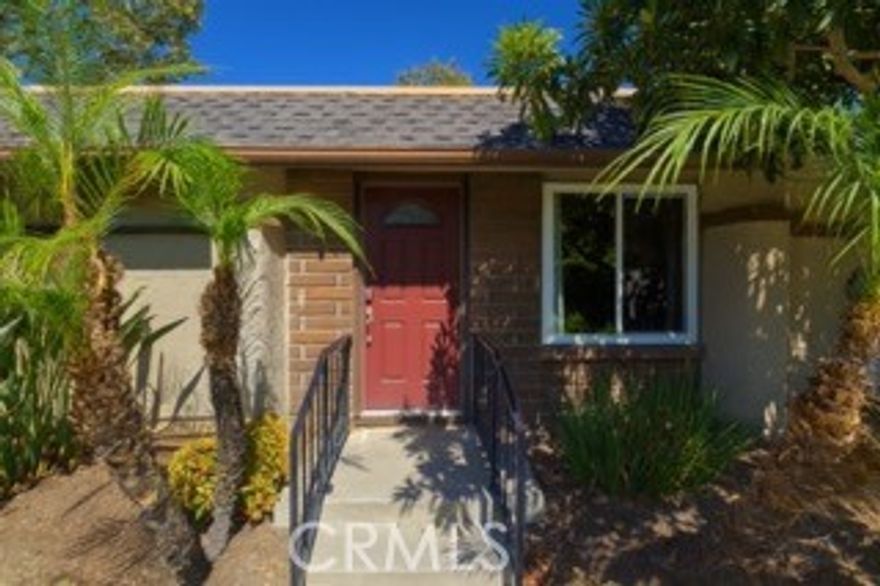 Welcome to this beautifully updated and private 3-bedroom, 2-bath single-story end unit. With only one shared wall, no neighbors above, and no homes directly in front— this rare find in such a desirable community won’t last long! Step inside to a spacious, open floor plan with laminate wood flooring throughout. The stylish, modern kitchen has self-closing cabinets and drawers, granite countertops with a unique bar-height counter—perfect for gatherings and entertaining. Stainless steel appliances and a sleek stainless steel sink add to this impressive design. This home boasts recessed LED lighting throughout the kitchen, living area, and hallway. The primary suite features a generous walk-in closet, while both bathrooms offer custom tile work, granite countertops, and brushed nickel fixtures for a fresh, contemporary look. Enjoy outdoor living in your private, fenced-in patio, complete with a planter box and apple tree. The patio opens to a large, open grassy area, giving you tons of space to relax or play. Additional features include: Extended detached single-car garage with storage rack, second assigned parking space right out front, and access to community pool. This home truly has it all - comfort, style, space, and an abundance of community amenities. Don’t miss your chance to live in this prime location turnkey gem!