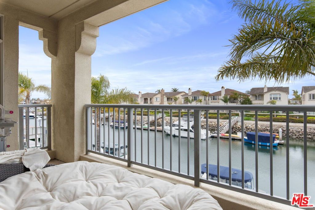 Nestled in the exclusive gated community at Whitesails in the Channel Island Marina. This spacious 2 bedroom 2.5 bathroom furnished condo is designed for comfort and coastal luxury. Providing you a 1,734 sq ft fully-furnished single story home offering you panoramic harbor views, fresh ocean breezes, and a serene indoor-outdoor lifestyle. Enjoy tranquil evenings by the water. Step out onto your expansive private balcony, where you can unwind, watch the boats and kayaks drift by and soak in the sunset ambiance over the marina. Inside the home, you'll have a Queen bed in the Master bedroom, an en-suite bathroom, walk-in closet, tv and desk. On the opposite side of the living room the second bedroom also with en-suite bathroom, features two Twin beds (can be converted into a king bed), tv and desk. The Den comes with a cozy daybed can also be converted to a dedicated home office setup ideal for remote work. The Living area has an open-concept layout with a gas fireplace with stone and hardwood flooring throughout. The spacious Kitchen and kitchen bar area is fully stocked with modern appliances and a large dining area perfect for any of your guests. There's also an in-unit washer/dryer.The community is gated and private with gated entrance and an elevator with direct access to two assigned garage parking spaces (side-by-side). Additional guest and EV parking is available. On site enjoy the immediate convenience of the harbor front cafe/restaurant and a large spa. Walking distance to beach, kayak rental, market, a variety of restaurants, cafes and shops at the Seabridge marina. Public golf courses near by. Easy access and scenic drive to Thousand Oaks, Westlake Village, Santa Barbara, Ventura and Malibu. Minimum one month rental period - Month to month rental - Corporate housing - Vacation rental - Relocation