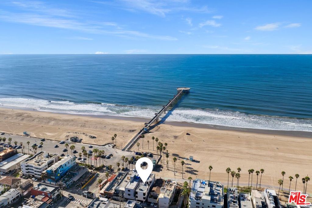 Live your best life on the Pacific Coast at the world-famous Venice Beach with this spectacular beachfront residence perfectly situated at the crossroads of Venice Beach and Marina del Rey. This fully furnished, move-in ready home features 2 bedrooms plus a convertible den/3rd bedroom designed for relaxed coastal living. Enjoy prime beachfront living just steps from the sand with stunning views of the Venice Pier, Malibu, and the endless Pacific Ocean. The modern, light-filled design includes Fleetwood sliding glass doors opening to a private beachfront patio and an open-concept great room with a gourmet kitchen equipped with Viking appliances, dining area, and cozy living room with an electric fireplace and large-screen TV. The convertible den and convenient bath on the main floor add flexibility, while private outdoor spaces offer panoramic beach, city, and mountain views from sun-drenched rooftop decks. The luxurious bedrooms are located on the second and third levels, featuring a spacious second-level bedroom with a full bath, and a top-floor primary suite with spa-like amenities, ocean views, and access to the rooftop deck. Additional amenities include a shared laundry room, elevator, and direct-entry garage. This residence comes fully furnished with linens, towels, full kitchen supplies, Dish Network, and internet. Just bring your suitcase and settle in! Located within walking distance to vibrant restaurants, trendy coffee shops, boutique shopping, and the coastal bike path connecting Manhattan Beach, Santa Monica, and beyond, this home offers the perfect blend of luxury and convenience. Available beginning August 1 with a minimum 30-day stay, no pets, and no smoking. Experience the coastal lifestyle you've always dreamed of. Schedule a showing today and immerse yourself in luxury beachside living.