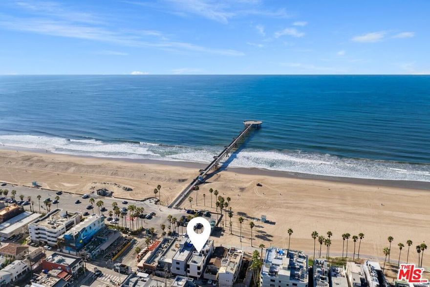 Live your best life on the Pacific Coast at the world-famous Venice Beach with this spectacular beachfront residence perfectly situated at the crossroads of Venice Beach and Marina del Rey. This fully furnished, move-in ready home features 2 bedrooms plus a convertible den/3rd bedroom designed for relaxed coastal living. Enjoy prime beachfront living just steps from the sand with stunning views of the Venice Pier, Malibu, and the endless Pacific Ocean. The modern, light-filled design includes Fleetwood sliding glass doors opening to a private beachfront patio and an open-concept great room with a gourmet kitchen equipped with Viking appliances, dining area, and cozy living room with an electric fireplace and large-screen TV. The convertible den and convenient bath on the main floor add flexibility, while private outdoor spaces offer panoramic beach, city, and mountain views from sun-drenched rooftop decks. The luxurious bedrooms are located on the second and third levels, featuring a spacious second-level bedroom with a full bath, and a top-floor primary suite with spa-like amenities, ocean views, and access to the rooftop deck. Additional amenities include a shared laundry room, elevator, and direct-entry garage. This residence comes fully furnished with linens, towels, full kitchen supplies, Dish Network, and internet. Just bring your suitcase and settle in! Located within walking distance to vibrant restaurants, trendy coffee shops, boutique shopping, and the coastal bike path connecting Manhattan Beach, Santa Monica, and beyond, this home offers the perfect blend of luxury and convenience. Available beginning August 1 with a minimum 30-day stay, no pets, and no smoking. Experience the coastal lifestyle you've always dreamed of. Schedule a showing today and immerse yourself in luxury beachside living.