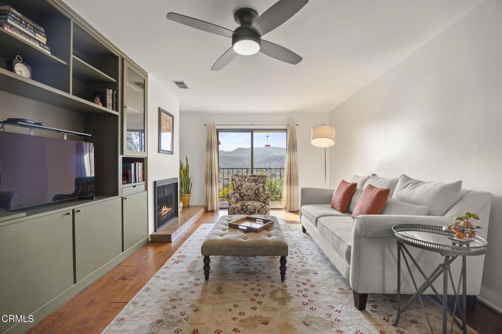 Modern comfort, impeccably updated. Be prepared to say WOW when you step into this condo with mountain and ocean views. See the difference in an owner's great attention to detail where quality craftsmanship meets thoughtful design. Located in a tranquil setting with stunning mountain views and partial ocean vistas, this home is move-in ready and packed with upgrades that offer both style and substance. Step inside to engineered hardwood floors that flow throughout the unit, complementing the open-concept layout. The living area features a gas fireplace, creating a cozy yet modern ambiance. A bespoke built-in bookcase has additional flair with a hidden bar. The kitchen was remodeled with beautiful teak butcher block countertops, a new oven range, new refrigerator, recessed lighting, and a new pantry--perfect for entertaining or everyday convenience. Both remodeled bathrooms deliver luxury. The ensuite features floor-to-ceiling tile in the walk-in shower. Every inch of this home has been carefully curated for comfort, function, and timeless appeal. Whether you're looking for a peaceful full-time residence or a stylish coastal retreat, this condo checks all the boxes.Improvements include: Remodeled bathrooms, new porcelain glaze bathtub, plumbing access panels to both bathrooms installed, engineered hardwood flooring throughout, remodeled kitchen with teak butcher block countertops, new oven range, new refrigerator, canned lighting, new pantry, new water heater, new fireplace components and pilot assembly and gas valve replaced full cleanout of fireplace system, custom built-in shelving with bar, and new 40-gallon water heater. Discreet access panels were added in adjoining closets for easy plumbing maintenance.Parking includes 1-car detached garage for storage PLUS parking car and 1 assigned carport spot.HOA fee includes: water, trash, sewer, master earthquake ins. policy, pool, spa, gym, clubhouse, and 85 acres of access for resident use.