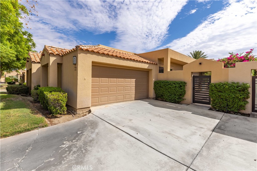Luxury living behind the gates of the Mission Hills Country Club! This wonderful Deane Home features a scenic golf course view, it does NOT have a land lease, and it has been extensively upgraded! These upgrades include new interior paint, new carpeting, new kitchen & bathroom cabinets, new kitchen & bathroom granite counters, upgraded subway tile in the kitchen, new stainless appliances, new light fixtures, new plumbing fixtures, and much more. The bathrooms feature beautiful custom tile surrounds, and attractive tile flooring covers most of the home. The floorplan is bright and light, with large windows overlooking the view. It has an open living room, spacious primary suite, brand new kitchen with ample cabinetry, in-unit laundry, and 2 additional bedrooms. One of the bedrooms is versatile, with a double door entry and a sliding door to the exterior that make it a possible den, home office, or guest bedroom. There is a private gated courtyard area at the front of the home (with new exterior gate) and a large patio area at the rear of the home, providing multiple areas for outdoor living. This home is situated on a nice street with an east-facing interior lot, and it has an attached 2 car garage. Mission Hills Country Club is a renowned private club with a wide variety of membership plans and amenities. HOA covers exterior maintenance, roof maintenance, landscaping, community pools/spas, trash service, cable TV and internet service. The Deane Homes perform well as seasonal rentals, with high rents and easy management. This is the perfect opportunity for someone looking for a quality home on fee simple land in Mission Hills Country Club. It has been nicely upgraded, it has a great view, and it's ready for immediate enjoyment. Also available for long-term lease at $4,295/month. Don't miss out!