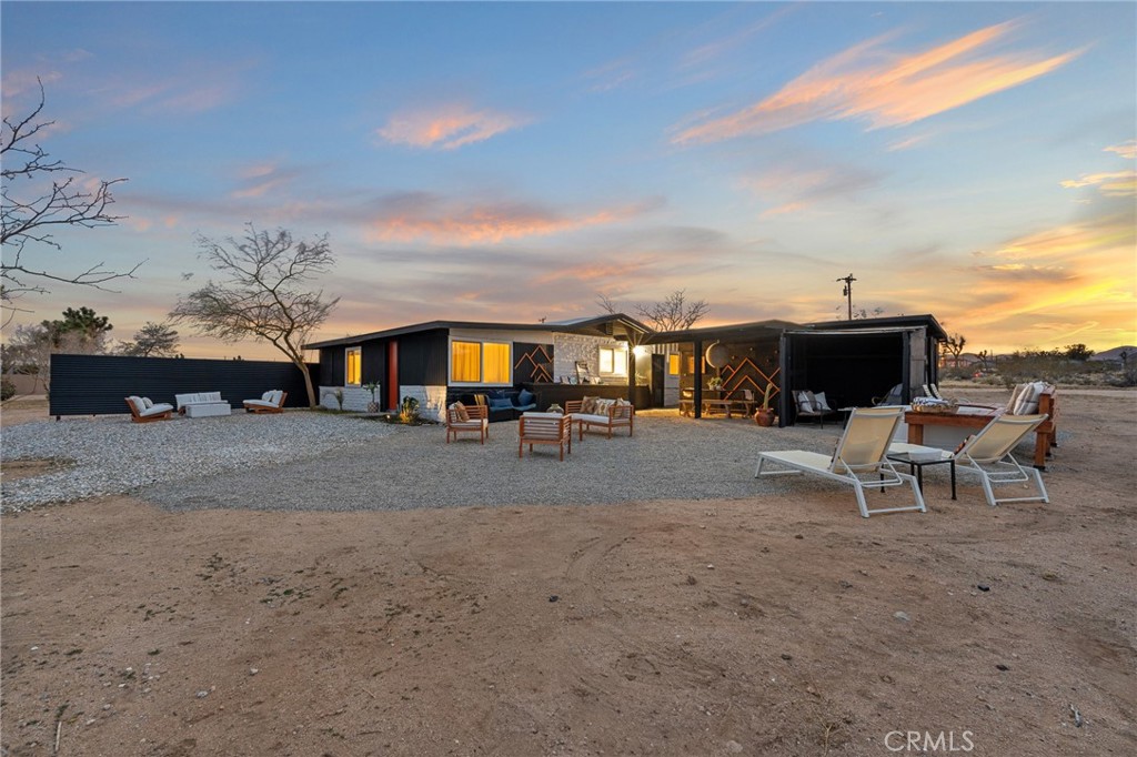 Flamingo Heights Hideaway: Set against the wide-open expanse of the Hi-Desert, this 1963 brick home blends midcentury character with thoughtful updates, creating a retreat that is both stylish and enduring. Featuring 3 bedrooms, 1 bath, and a bonus room for a studio, office, or even a coveted 4th bedroom, the layout invites creativity and flexibility.
Recent improvements include high-end laminate wood flooring, a brand-new roof, and privacy fencing—adding modern comfort to timeless desert charm. The property spans 5 acres with unobstructed views of Goat Mountain, buffered by 7.5 acres of adjacent government land to preserve your sweeping panoramas and ensure lasting privacy. An original homestead cabin rests quietly among bamboo groves, awaiting transformation into a Western bar, creative workshop, or meditative retreat.
Outdoor living is defined by tranquil days and starlit nights—experience breathtaking sunsets across the mesa, then watch the desert sky come alive with constellations, planets, and the shimmering Milky Way. Just minutes away, indulge in acclaimed farm-to-table dining at La Copine (5 minutes), world-class entertainment at Pioneertown’s legendary Pappy & Harriet’s (15 minutes), and restorative sound baths at the Integratron (8 minutes). Adventure seekers can lose themselves among the boulders of Giant Rock or wander the trails of nearby Joshua Tree National Park, only 20 minutes away.
Flamingo Heights Hideaway is more than a home—it’s a rare opportunity to live in harmony with nature while remaining close to the best of the Hi-Desert. A true desert dream, waiting to be written into your story.