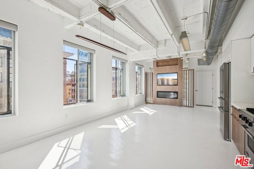 Live/Work Loft Located in the heart of Hollywood w/ Panoramic City Views through Walls of Windows! Contemporary elegance with a taste of urban living in a full service 24 hour doorman and valet building at the prestigious Lofts @ Hollywood and Vine. Stunning unit offers an immaculate sleek white kitchen with Viking appliances & modern cabinets. Bedroom area features fine architectural details incorporated into the raw industrial features of the 1929 landmark building. Roof top deck offers 360 degree views w/ fire-pit and BBQ. Walk to everything, including all the best restaurants, entertainment and nightlife that Hollywood has to offer. Located above Separano and across from Katsuya, W Hotel, Pantages, Equinox, Trader Joe's and The Aster Social Club, just to name a few. Metro station across the street allows for 15 min easy commute to DTLA and beyond. Urban NY style living in the heart of LA!