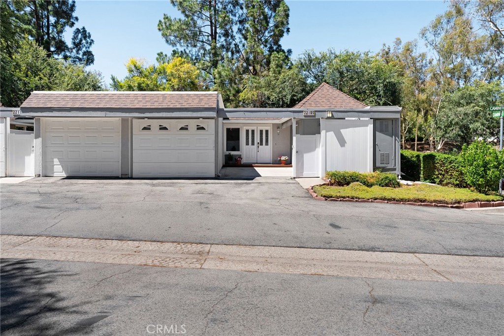 Tucked away in a peaceful, woodsy setting, this hidden gem offers the perfect blend of tranquility and convenience. Surrounded by lush greenery, it feels like a private retreat while still being just moments from shopping, dining, and all that Laguna Hills has to offer.Step inside and you’ll be welcomed by an inviting open floor plan with custom paint, newer flooring, and updated windows and crown molding throughout. The spacious living room opens seamlessly to a large balcony overlooking the wooded landscape—an ideal spot to relax with a morning coffee or unwind at the end of the day.The chef’s kitchen is a true centerpiece, thoughtfully designed with style and function in mind. It boasts gleaming granite countertops, stainless steel appliances, a double oven, a convenient breakfast bar, custom flooring, and abundant cabinet space, including a lazy Susan for easy storage. Perfect for preparing gourmet meals or hosting friends and family.Down the hall, you’ll find a generously sized bedroom with plenty of closet space, along with a beautifully upgraded Jack and Jill bathroom featuring modern fixtures and fresh finishes.When it’s time to retreat, head downstairs to the spacious suite with double closets, a stylish accent wall, and sliding glass doors that open to a private patio. This versatile room can serve as a primary suite or guest quarters. The third bedroom adds additional flexibility, complete with a clever built-in Murphy bed that makes the space both functional and inviting.Don’t miss the opportunity to own your own piece of paradise in Laguna Hills—where comfort, convenience, and natural beauty come together.