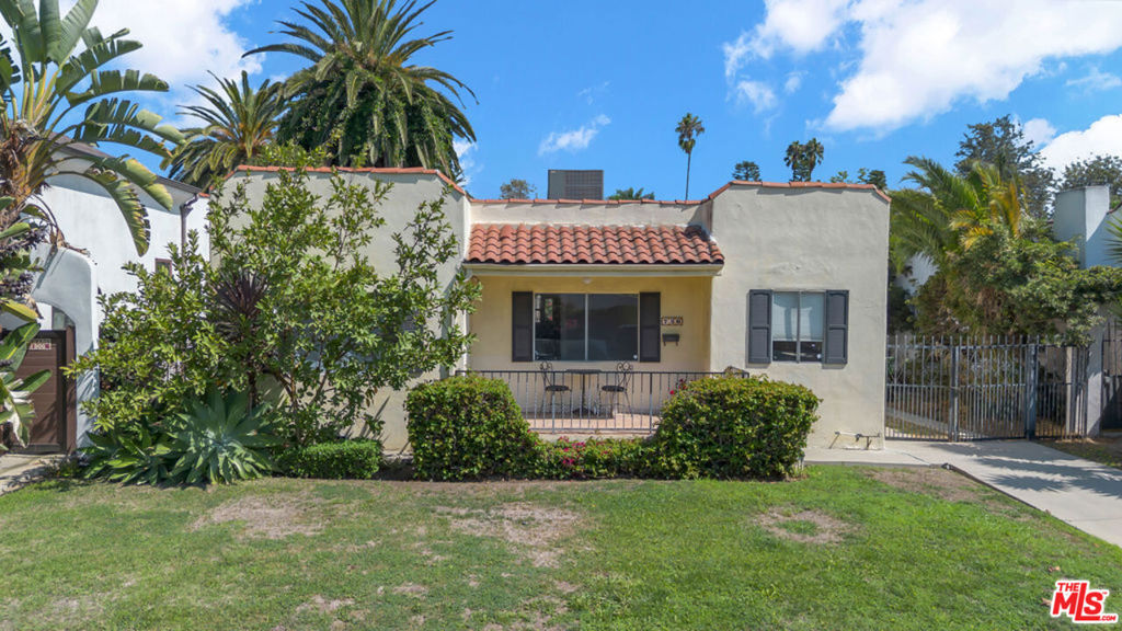CHARMING SPANISH BUNGALOW WITH EXTRA-LARGE YARD IN WEST HOLLYWOOD AREA. Enter this 1920's pied-a-terre through a lovely front porch into an expansive living room with decorative mantel, adjoining a formal dining room, remodeled kitchen with stainless steel appliances, separate laundry room with washer and dryer and convenient side entrance. A very large, private backyard offers two lounging areas with plenty of additional space. Additional features include hardwood floors throughout, central AC, large private driveway with parking for multiple cars, ideally located just a stone's throw from amazing dining, shopping, and entertainment venues.