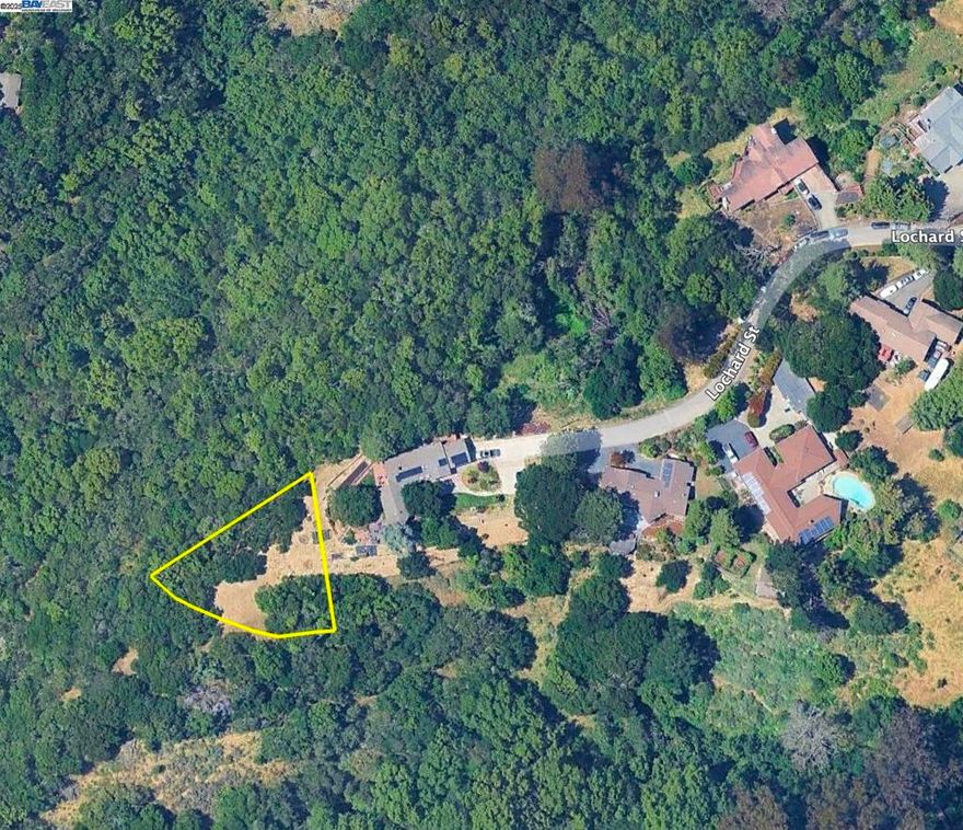 Flat triangular lot offers amazing views of the central bay and oak-studded canyons of Chabot Park. Lot includes 50 ft easement along neighbor's northern  property line for unbuilt access road. Great opportunity to build a home in Oakland Hills without needing to buy a large slope.