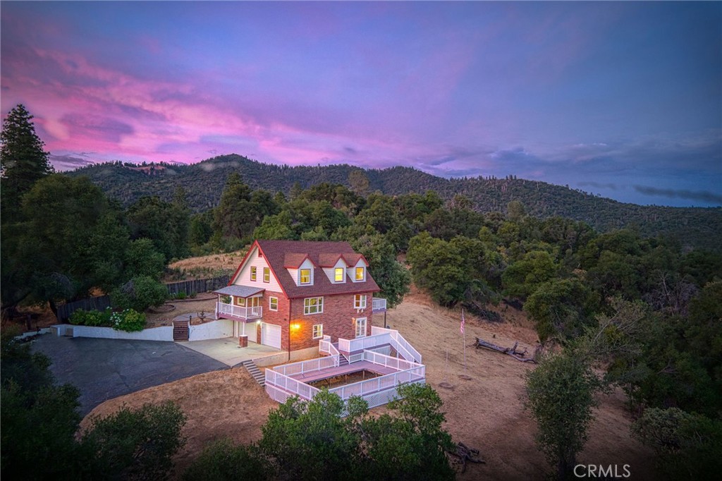 Major Price Drop - Vacation Rental Investment Opportunity!
Unlock serious short-term rental income potential with this spacious 4-bedroom, 4-bathroom home in Ahwahnee, CA, offering unbeatable panoramic views of the Sierra Nevada Mountains. At over 3,400 sq. ft., this upgraded brick home sits on 2.34 private acresperfect for investors seeking a high-return vacation rental property.
Every bedroom features mountain views, and recent upgrades include:
-New LVP flooring, granite countertops, and dual-pane windows
-Resurfaced deck and remodeled downstairs bathroom
-French drain system in back yard and open-concept main floor layout
The luxury primary suite offers a soaking tub and custom-tiled shower with dual shower heads. Upstairs includes three additional bedrooms, full bathroom and a bonus office or craft room. The finished downstairs area with a bathroom is ideal for a game room, entertainment space, or extra guest accommodations.
An oversized 2-car garage with a half bath provides room for storage or recreation equipment. Plus, with space for a hot tub and pool on the deck area, there's room to enhance amenities and maximize nightly rental rates.
Located just 15 minutes from Oakhurst and 40 minutes from Yosemite National Park, this property combines privacy, location, and income potential. Two storage sheds add even more value.
Don't miss out schedule your private tour today and see what this investment property can offer!