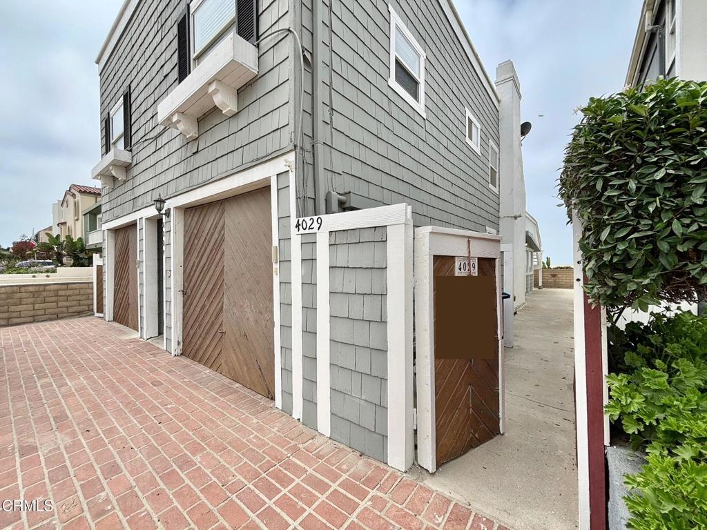 Live just steps from the sand in this charming oceanfront home share, perfectly situated on Hollywood Beach in Oxnard. Wake up to the sound of waves and enjoy panoramic ocean views from your living room and bedroom in this sunny, relaxed coastal retreat.Step into the bright front bedroom with wall-to-wall windows and breathtaking views of the Pacific. The cozy living area features a fireplace for cool beach nights and opens up to a well-equipped kitchen with a gas stove and refrigerator provided.Down the hall, you'll find a second bedroom, a full bathroom, and access to a private single-car garage through the back door. Additional perks include an shared in-unit washer and dryer in garage, a spacious front patio perfect for relaxing or entertaining and 1 car parkingWhether you're catching sunsets from your window or strolling to nearby harbor cafes and beach spots, this is coastal living at its best--with all the comforts of home.Schedule your private showing today.