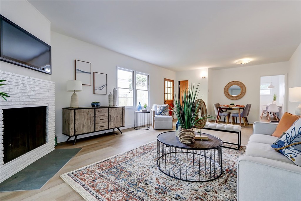 Light filled mid century ranch home with a floor plan open to the backyard from the living area and also from the primary bedroom! A quiet oasis in the best location - walk to Pacific School, American Martyrs School, downtown Manhattan Beach, the pier and the best white wide sandy beach in southern California! Walk through the front door and see straight out to the beautiful backyard oasis! This newly refurbished beach home features wide plank vinyl flooring throughout, spacious living room with a fireplace, private and serene back yard with a covered patio and plenty of room to play, entertain, relax. New heating and central air conditioning assure year round comfort, direct access from the two car garage, and a very private primary suite plus 3 additional bedrooms. This is one of those "park your car for the weekend" homes - you can walk everywhere, including Vons, Starbucks, the best restaurants, the beach, great parks and of course those award winning schools!