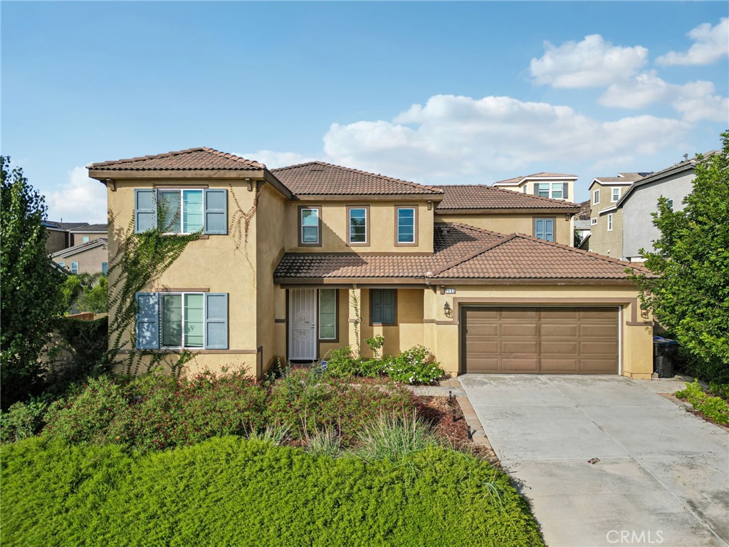 Beautiful 4 bed, 3.5 bath Jurupa Hills home offers great curb appeal with 2,959 sqft of living space and sitting on a 8,276 sqft lot! The interior features an  open and spacious floor plan with recessed lights, vinyl flooring in the main living spaces, and an abundance of natural light throughout. The huge living room flows into the dining area and the gorgeous kitchen with large center island, granite countertops, wood cabinetry and a pantry. A main floor bedroom, full size bathroom, and a half bathroom complete the main floor. Upstairs you will find a huge bonus loft or 5th bedroom option as well as the primary suite with private ensuite featuring a soaking tub and a separate shower, as well as a walk-in closet. There is also a 2nd floor, full-size, hall bathroom for the 2 secondary bedrooms to share, and a large laundry room with extra storage space. Relax and entertain in the lush backyard with covered patio, and this home also has an attached 3-Car Garage. Conveniently located not far from shopping, dining, Oak Quarry Golf Club, trails, and the 60 Fwy, schedule your tour today!  ****(All the the furniture is for sale in the house.)****