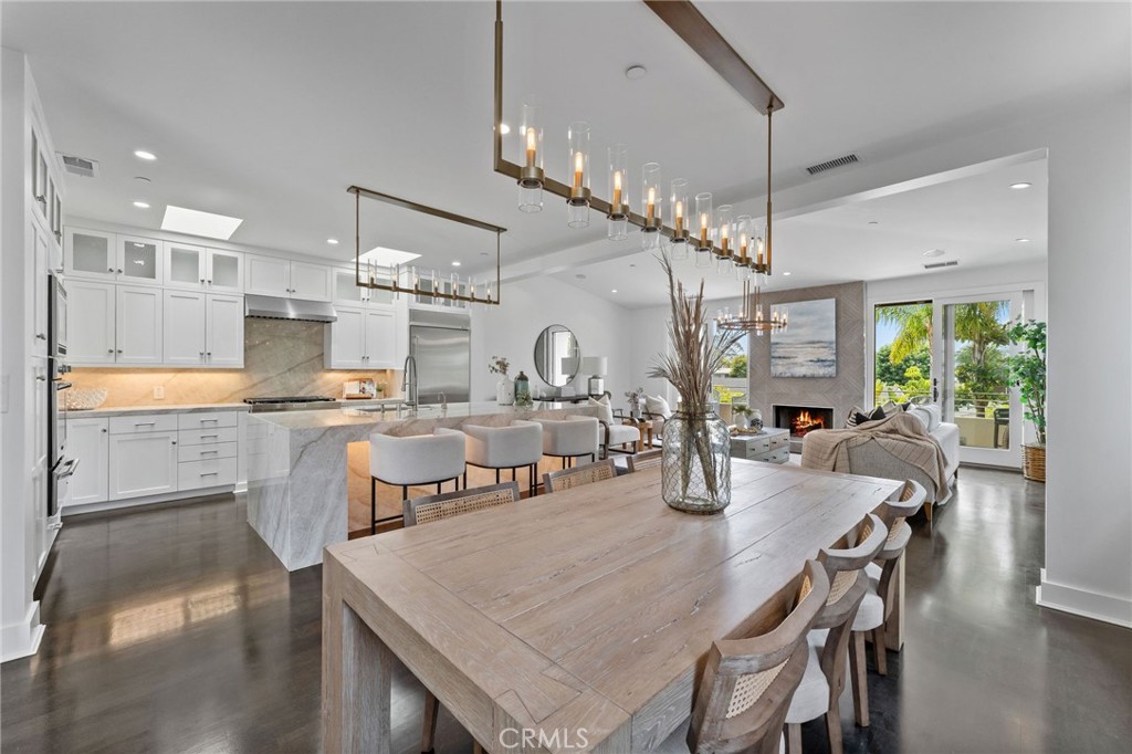 Luxury, Lifestyle, Ocean Views and the exclusivity of Corona Del mar. The most sought after real estate market in Southern California. This could easily be your forever home, or perhaps a second home on the coast for those summer memories, This home has it all. Located in the heart of Corona Del Mar this property is walkable to the beaches and has private access to baby CDM beach. The downtown village is just a short walk away to grab your morning coffee and scone before enjoying all the charm Corona Del mar has to offer. Every attention to detail was given to this luxury property from the quarts counters, to the Thermador chefs oven, to the upgraded stainless appliances. This gourmet kitchen is any entertainers dream. Perfect for an intimate dinner setting or a large party. Step out onto the balcony and enjoy your ocean view and the cool ocean breeze. Each of the primary suites has on suite bath rooms. One with a jetted tub, Quarts dual sinks and a large walk in closet with space for all the accessories including your designer bags. The secondary primary features a steam shower that leaves you with the feeling you are in your own private spa. The main level features the 3rd bedroom which also has its own on suite bath. There was not a single detail missed, from the solid core doors with highly upgraded hardware and finishes. there is nothing to do except move in and enjoy.