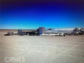 This land offers a great business opportunity, and the business plan will be included. There are 42 greenhouse frames set up and ready for plastic, along with numerous water walls, fans, and pots filled with good soil. Additional greenhouse frames are also on the land.
You can farm the flat, graded 8+ acres with crops like agave, among others. It is a large, empty area. The greenhouses will provide protection for more delicate plants or vegetables. This location is in a hemp-approved area. You'll need to secure permits through the county if you decide to pursue that.
The water well and pump are now operating. There is a 10,000-kW generator and a solar system. There is a place to live on the property, with an additional one available.
Security is on the property 24-7
There is a money-making opportunity available here now!!! Don't let it pass up those clients who like a life of farming, tranquility, and quiet