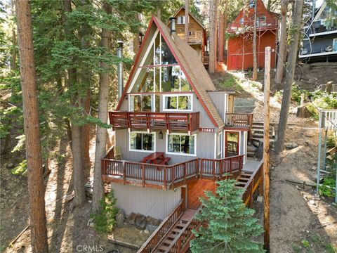 Photo of 31661 Wagon Wheel Dr, Running Springs, CA 92382 (MLS # IG25262695)