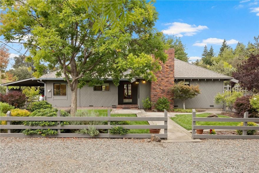 One Of A Kind Property Near Bidwell Park! This beautiful and unique 3 bedroom 2 bath home built in 1920 sits on just under 2 acres and is situated down the street from lower Bidwell Park! With its serene setting, gorgeous remodeled kitchen, high ceilings, tons of windows allowing for great natural light, detached workshop, barn, pastures, fantastic location and more - this home will not last long! The stunning remodeled kitchen features marble counters, a kitchen island, wood floors, plenty of storage, and a bar area and is open to the dining room and family room, which has French doors leading to the deck and fantastic backyard - perfect for entertaining. There is also a separate living room with wood paneled beamed ceilings and a brick fireplace that leads to the primary suite in this split floor plan home. The primary suite has French doors leading to the back deck, wood paneled beamed ceilings, a walk-through closet, and a unique tile bathroom with a shower and extra storage. The large detached workshop building with 2 rooms has high ceilings, hot and cold water, and a dark room, making it great for an art studio, office, projects, storage and more! The beautifully landscaped yard has concrete patios, pomegranate and dogwood trees, looks out to the corral and pasture with troughs and water for horses, and has a pathway leading to the iconic and well maintained spacious barn, which has 4 horse stalls. Additionally, there is a whole house fan, indoor laundry, and a brand new roof for both the home and workshop! This home is an absolute gem and truly one of a kind! Don’t miss the opportunity to own this incredible home and property priced at $865,000!