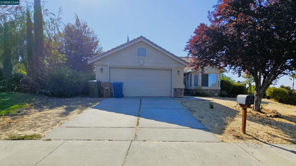 Opportunities like this don’t come often — and they don’t last long. This elevated, east-facing single-story home on a sweeping corner lot is strategically priced well below market, offering savvy buyers instant equity and endless potential. Step through the foyer into a vaulted-ceiling living room filled with natural light, warmed by a gas fireplace, and opening to a spacious backyard ready for your vision. The kitchen features abundant cabinetry, a pantry, and a sunlit breakfast nook — a perfect space to reimagine into your dream chef’s kitchen. Three generously sized bedrooms, including a primary suite with en-suite bath, provide room to grow. Convenient indoor laundry connects directly to the finished garage, adding everyday functionality. With solid bones, timeless stucco-and-stone exterior, and tile roof, this is a cosmetic fixer’s dream. Ideally located near parks, schools, shopping, dining, trails, BART, and Hwy 4. In today’s market of elevated inventory, this rare, well-priced home stands out — act fast before it’s gone. NOTE: Some photos are older and used for conceptual purposes.
